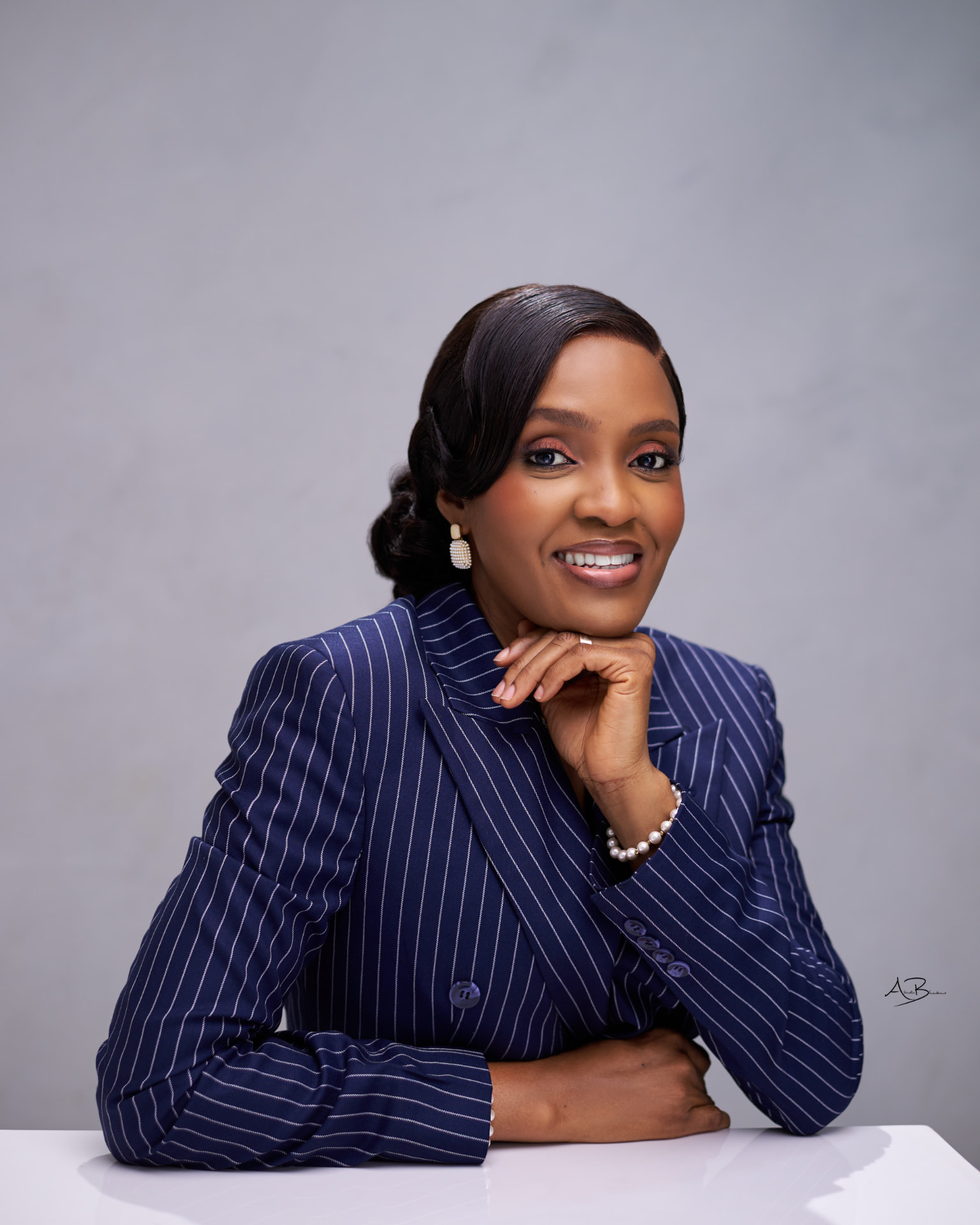 Rev. Dr. Bimbo Mesele in a blue pinstripe jacket